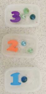 Frozen Numbers and Marbles