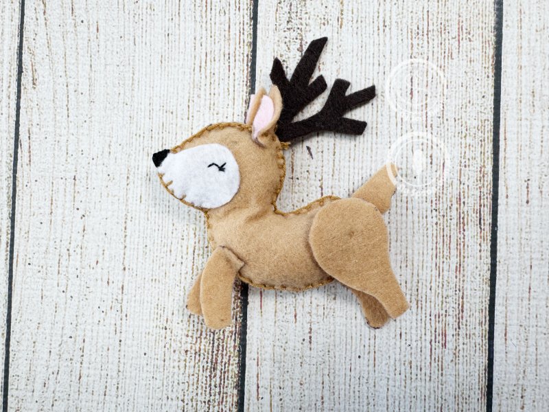 Set of handmade felt reindeer plushies – festive DIY Christmas craft idea.