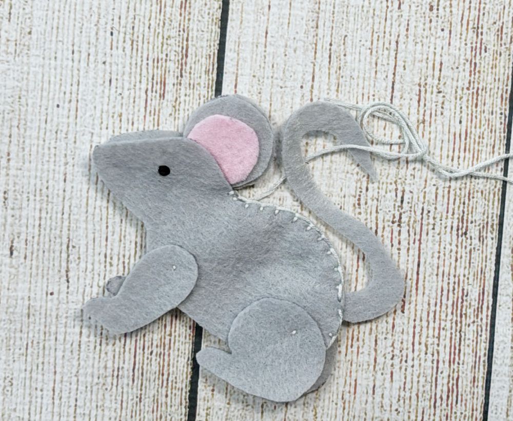 Using a blanket stitch to sew along back of mouse