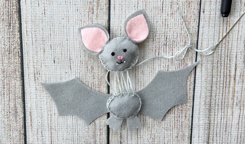 ladder stitch to attach felt bats head to bats body