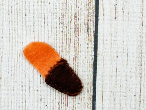 Blanket stitching around the paws to add the dark socks