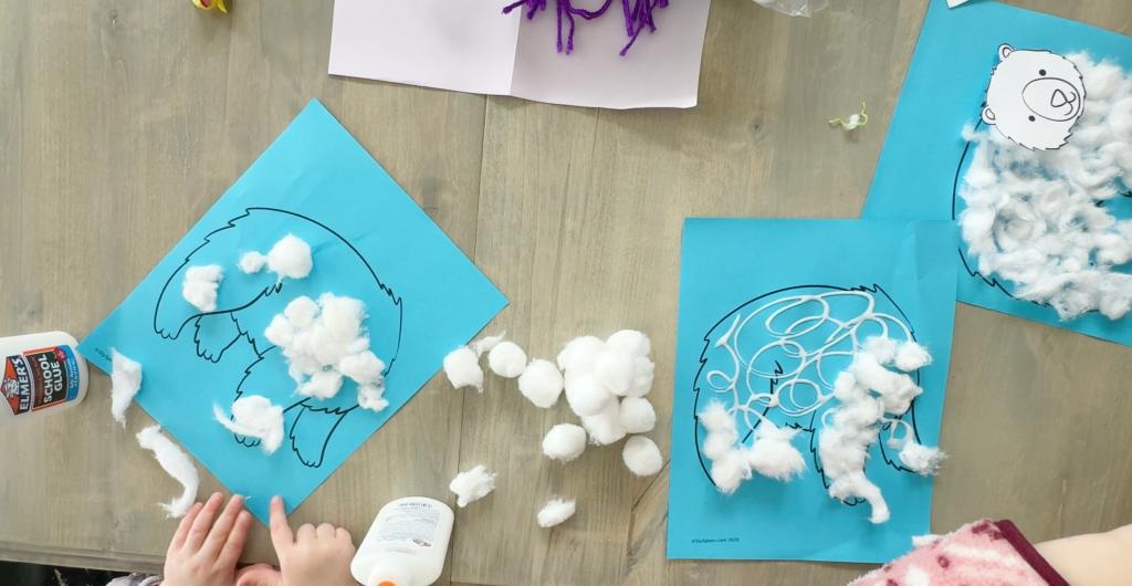 Winter polar bear craft with cotton ball body and yarn scarf, made using printable templates for preschool and early elementary kids.