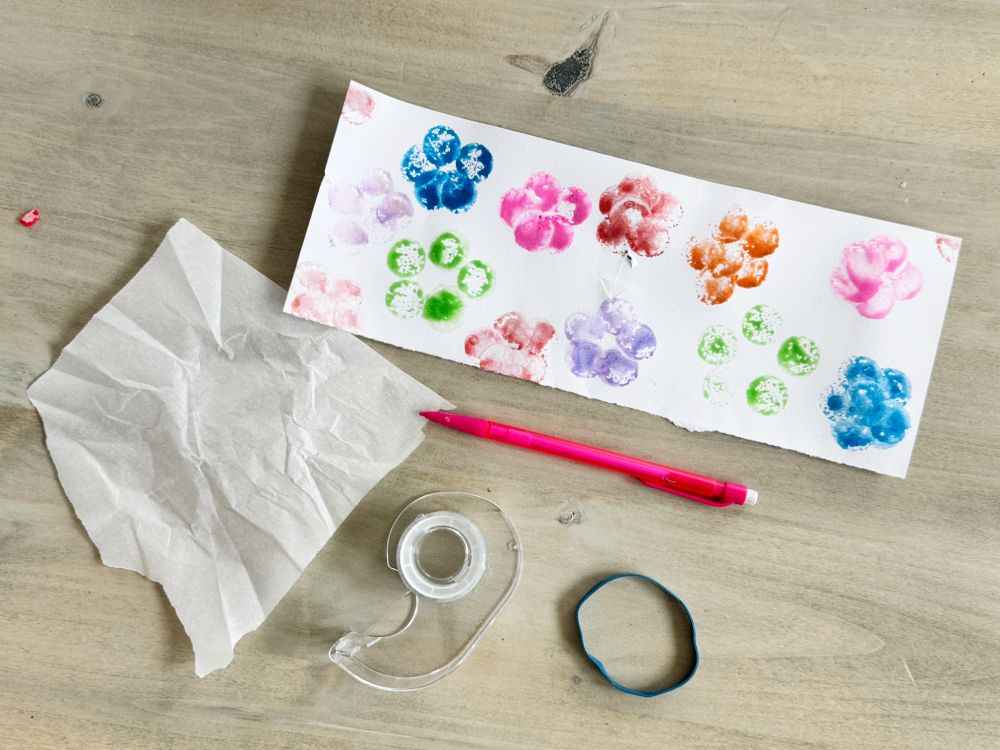 How to make a simple Kazoo, great for Letter K activity ideas - decorate a piece of card stock cut in half length wise.