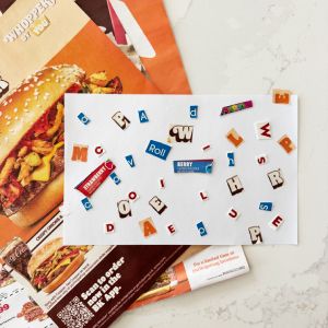 Letter cut and paste collage activity using recycled materials