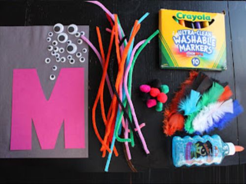 Letter M monster craft with googly eyes and pipe cleaners