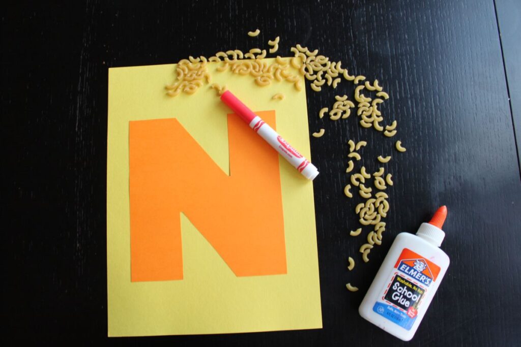 Letter N Noodle craft with different kinds of noodles glued to a letter N to make a fun tactile craft