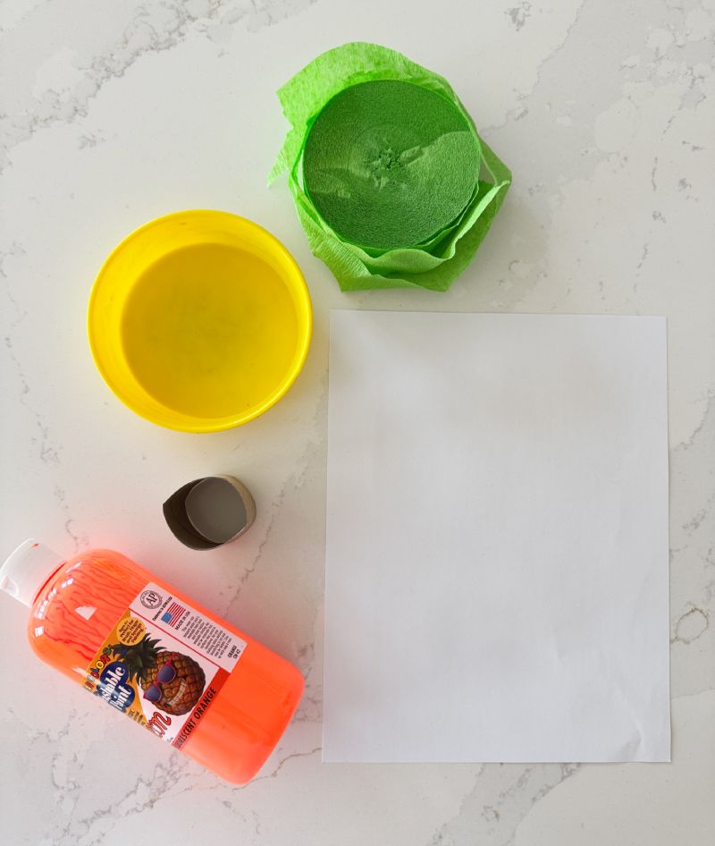 Letter O is for Orange Orchard Stamp Activity stamping with a paper tube and orange paint
