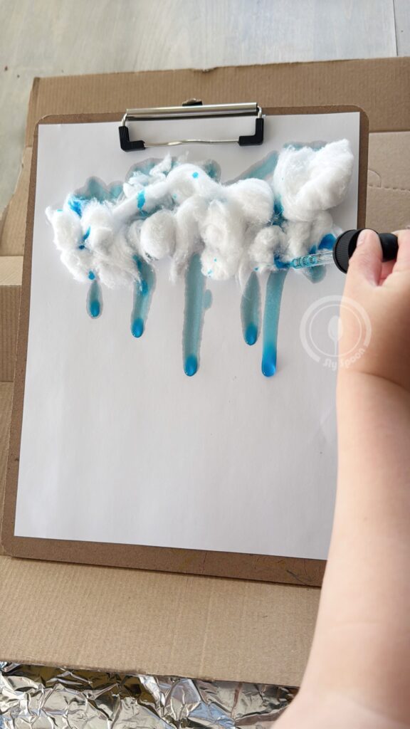 dripping paint through cotton ball rainclouds