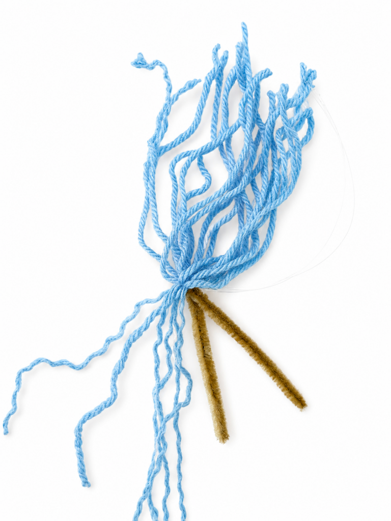 Creating curly yarn hair for a beginner fiber art mermaid.