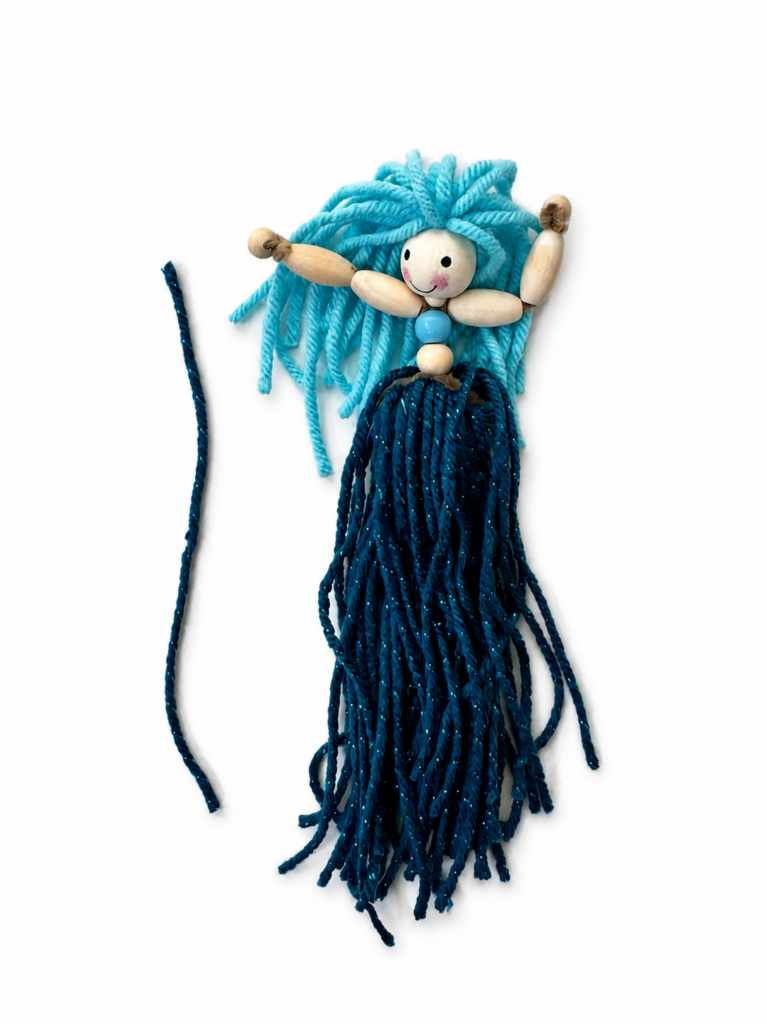 Yarn tail attached beneath the wooden body bead of a DIY pipe cleaner mermaid doll.