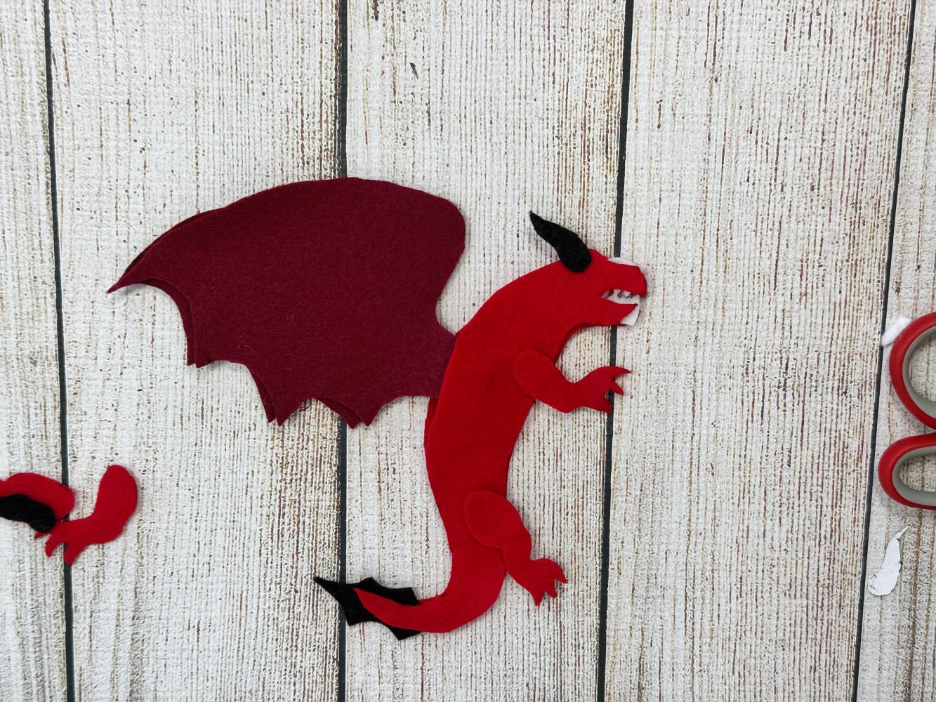 Felt horns and teeth positioned inside the dragon body before sewing