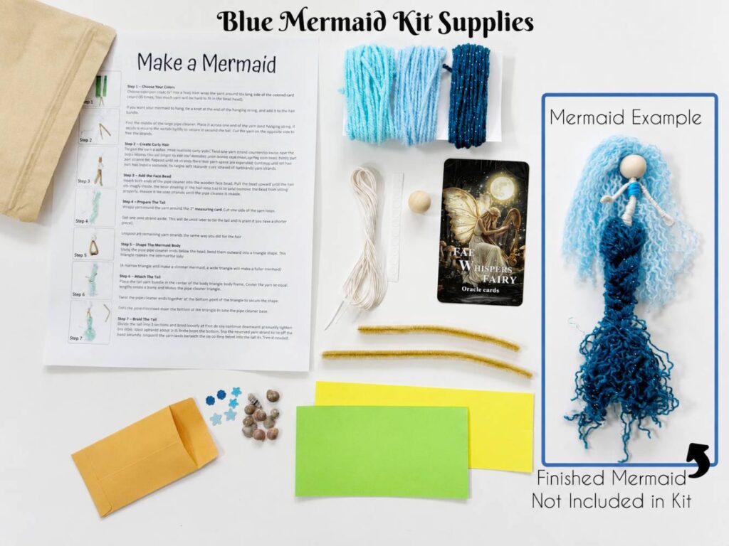 DIY fiber art mermaid kit supplies including yarn, pipe cleaners, beads, instructions and embellishments for making a beginner yarn mermaid.