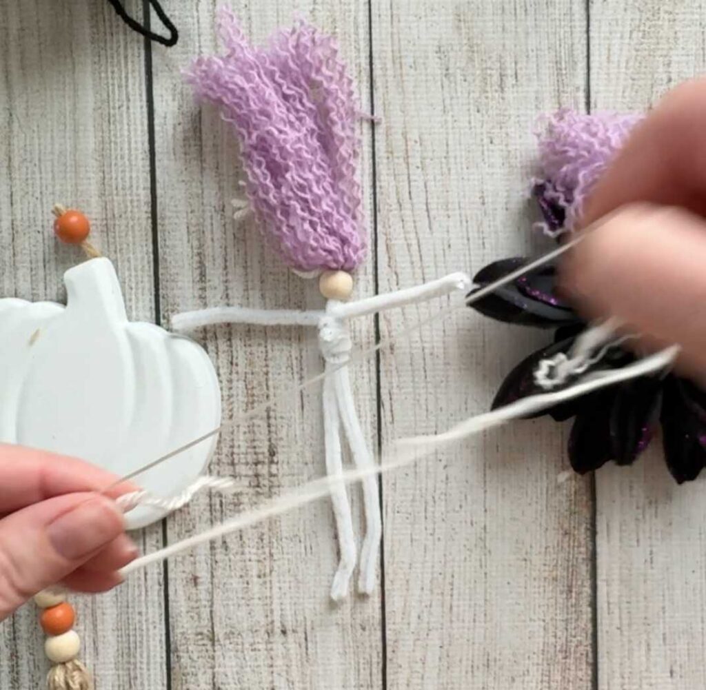 Easy Dollar Tree Halloween Craft Make a Witch tutorial - making thinner yarn