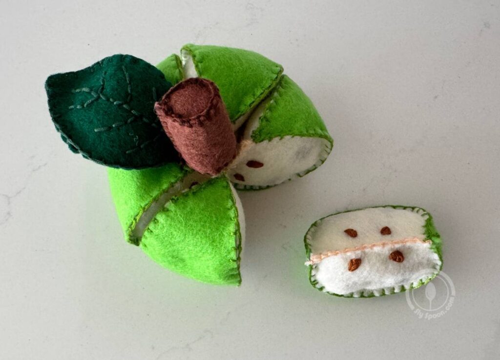green pull-apart felt apples with removable slices and stitched seeds
